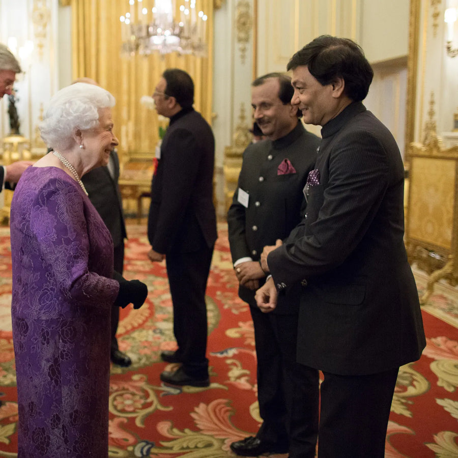 Mr Rajiv Arora Mr Rajesh Ajmera with the Queen at Buckingham palace